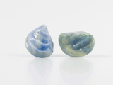 360 degree detail view of mussel shell shaped flamework glass earring studs in blue and yellows hues.
