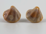 360 degree detail of glass ear studs on stainless steel ear posts in nacreous pink.