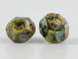 360 degree detail view of barnacle earrings with stainless steel ear stud. The set has one lacuna and one operculum shape.