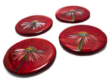 four glass coasters with images of echinacea flower on a red background. image is on a white background.
