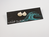 Shell shaped flameworked glass earring studs in ivory displayed on an earring card.