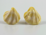 360 degree view of shell shaped earring studs with stainless steel earring posts in ivory sand colour.