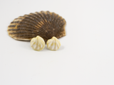 Flameworked glass earring studs in a pale yellow ivory colour.