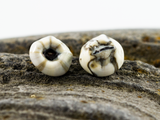 Detail of mini barnacle earring studs.
