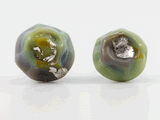 360 degree detail view of barnacle earrings with stainless steel ear stud. Variegated sea-green with silver foil.