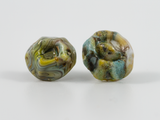 Front detail of barnacle shaped earring studs in swirls of multicolour glass.