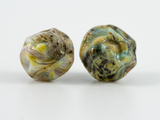 Front detail of beaked operculum style barnacle shaped ear studs in multi-tones of yellow, greens & blues.